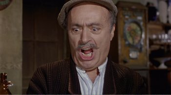 Movie still from “Fanny” (1961), directed by Joshua Logan – An older man with a mustache and a hat; Close Up shot, Low angle