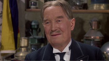 Movie still from “Fanny” (1961), directed by Joshua Logan – An older man wearing a suit and a tie; Close Up shot, High angle
