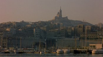 Movie still from “Fanny” (1961), directed by Joshua Logan – A view of a large city with many boats in the water; Extreme Wide shot, High angle