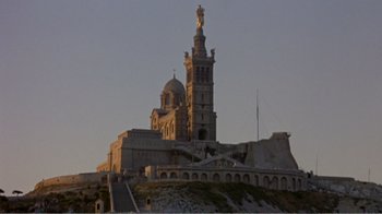 Movie still from “Fanny” (1961), directed by Joshua Logan – A very large building with a very tall tower on top of it; Extreme Wide shot, Low angle