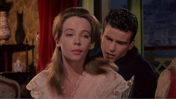 Movie still from “Fanny” (1961), directed by Joshua Logan – A man and a woman looking at one another; Close Up shot, Over the shoulder angle