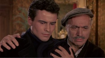 Movie still from “Fanny” (1961), directed by Joshua Logan – A man and a man with a hat on; Close Up shot, High angle