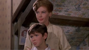 Movie still from “Fanny” (1961), directed by Joshua Logan – A woman and a young boy standing next to each other; Close Up shot, Low angle