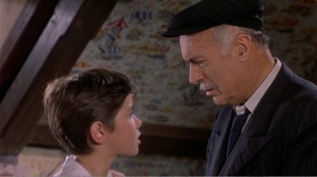 Movie still from “Fanny” (1961), directed by Joshua Logan – An older man and a young boy looking at each other; Close Up shot, Over the shoulder angle