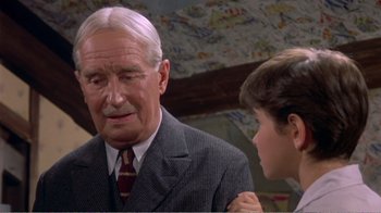 Movie still from “Fanny” (1961), directed by Joshua Logan – An older man and a young boy are talking; Close Up shot, Low angle