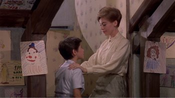 Movie still from “Fanny” (1961), directed by Joshua Logan – A woman and a young boy standing next to each other; Medium shot, High angle