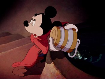 Movie still from “Fantasia” (1940), directed by Ford Beebe Jr. – A cartoon of a mickey mouse carrying a barrel; Medium shot, Low angle