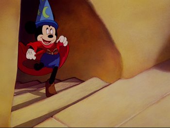 Movie still from “Fantasia” (1940), directed by Ford Beebe Jr. – Mickey mouse in a costume running down a ramp; Wide shot, Low angle