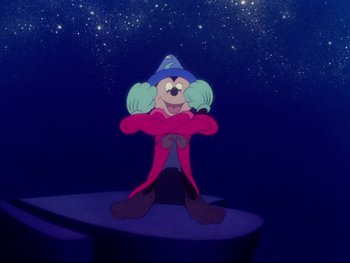 Movie still from “Fantasia” (1940), directed by Ford Beebe Jr. – A cartoon character is standing in front of a star filled sky; Medium shot, Low angle