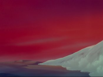 Movie still from “Fantasia” (1940), directed by Ford Beebe Jr. – A painting of a mountain range with a red sky in the background; Extreme Wide shot, Low angle