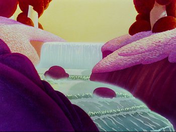 Movie still from “Fantasia” (1940), directed by Ford Beebe Jr. – View of a waterfall and some rocks; Extreme Wide shot, Low angle