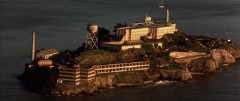 Movie still from “The Rock” (1996), directed by Michael Bay – A view of alcatraz island from the water; Extreme Wide shot, High angle