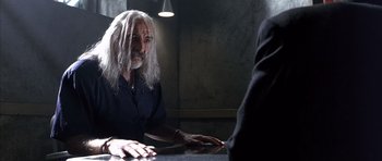 Movie still from “The Rock” (1996), directed by Michael Bay – An older man with long white hair talking to a younger man; Close Up shot, Over the shoulder angle