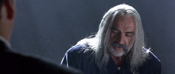 Movie still from “The Rock” (1996), directed by Michael Bay – An older man with long white hair and a beard; Close Up shot, Low angle