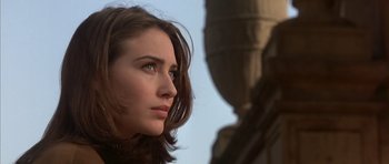 Movie still from “The Rock” (1996), directed by Michael Bay – A person with long brown hair; Close Up shot, Low angle