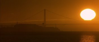 Movie still from “The Rock” (1996), directed by Michael Bay – A view of the golden gate bridge from the water; Extreme Wide shot, Low angle