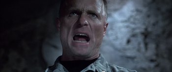 Movie still from “The Rock” (1996), directed by Michael Bay – A person with his mouth wide open; Close Up shot, Low angle