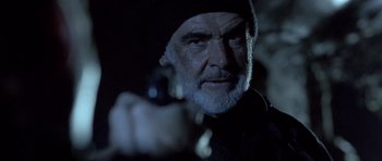 Movie still from “The Rock” (1996), directed by Michael Bay – An old man with a gun in a dark room; Close Up shot, Low angle