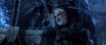 Movie still from “The Rock” (1996), directed by Michael Bay – An older man with a beard and a white beard; Close Up shot, Low angle