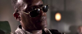 Movie still from “The Rock” (1996), directed by Michael Bay – A person wearing sunglasses; Close Up shot, Low angle