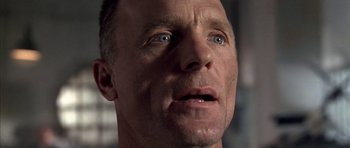 Movie still from “The Rock” (1996), directed by Michael Bay – A man's face looking upward; Close Up shot, Low angle