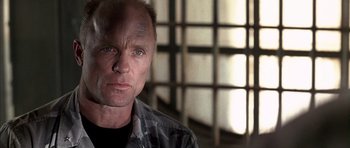 Movie still from “The Rock” (1996), directed by Michael Bay – A person wearing a jacket; Close Up shot, Low angle