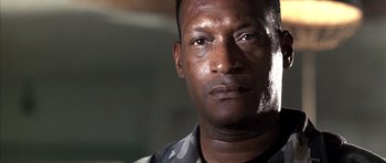 Movie still from “The Rock” (1996), directed by Michael Bay – A person wearing a military uniform; Close Up shot, Low angle