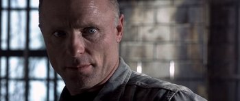 Movie still from “The Rock” (1996), directed by Michael Bay – A person with a beard; Close Up shot, Low angle