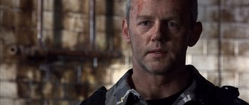 Movie still from “The Rock” (1996), directed by Michael Bay – A person wearing a shirt; Close Up shot, Over the shoulder angle