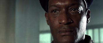 Movie still from “The Rock” (1996), directed by Michael Bay – A man's face with a hat on; Close Up shot, Low angle