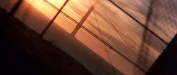 Movie still from “The Rock” (1996), directed by Michael Bay – A view of the golden gate bridge at sunset; Extreme Wide shot, Low angle