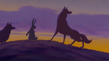 Movie still from “Fantasia 2000” (1999), directed by Eric Goldberg – A dog and a rabbit sitting on top of a hill at sunset; Wide shot, Low angle