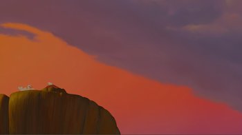Movie still from “Fantasia 2000” (1999), directed by Eric Goldberg – A red sky with a mountain in the background; Extreme Wide shot, Low angle