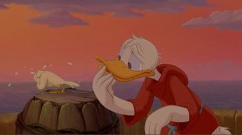 Movie still from “Fantasia 2000” (1999), directed by Eric Goldberg – A cartoon of a person holding a duck in his mouth; Medium shot, Over the shoulder angle
