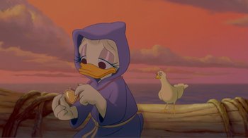 Movie still from “Fantasia 2000” (1999), directed by Eric Goldberg – A cartoon of donald duck holding an egg and standing next to a chicken; Medium shot, High angle