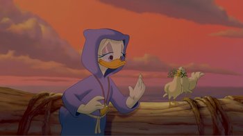 Movie still from “Fantasia 2000” (1999), directed by Eric Goldberg – A cartoon of a duck wearing a purple hooded sweatshirt; Medium shot, Over the shoulder angle