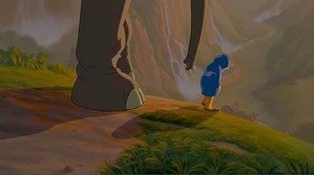 Movie still from “Fantasia 2000” (1999), directed by Eric Goldberg – An animated scene of a person walking up a hill with an elephant; Wide shot, Low angle