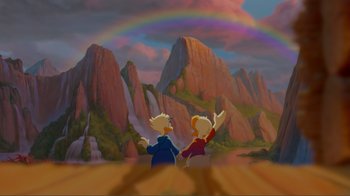 Movie still from “Fantasia 2000” (1999), directed by Eric Goldberg – Two people standing in front of a mountain with a rainbow in the background; Extreme Wide shot, Low angle