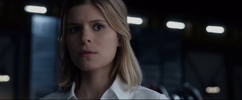 Movie still from “Fantastic Four” (2015), directed by Josh Trank – A person wearing a white shirt; Close Up shot, Low angle