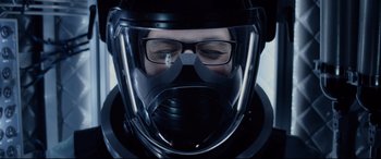 Movie still from “Fantastic Four” (2015), directed by Josh Trank – A person wearing a helmet and glasses; Close Up shot, Over the shoulder angle