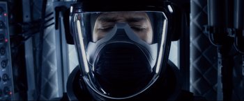 Movie still from “Fantastic Four” (2015), directed by Josh Trank – A man wearing a helmet and a mask; Close Up shot, Overhead angle