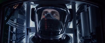Movie still from “Fantastic Four” (2015), directed by Josh Trank – A man wearing a space helmet looking into the distance; Close Up shot, Overhead angle