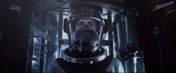 Movie still from “Fantastic Four” (2015), directed by Josh Trank – A man in a space suit and a helmet; Close Up shot, Low angle