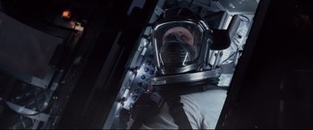 Movie still from “Fantastic Four” (2015), directed by Josh Trank – A man in a space suit and a helmet; Close Up shot, Overhead angle