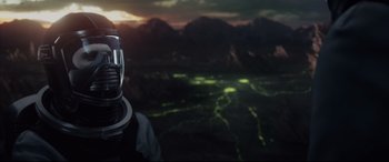 Movie still from “Fantastic Four” (2015), directed by Josh Trank – A man in a space suit standing in front of a landscape; Close Up shot, Over the shoulder angle