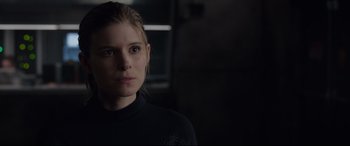Movie still from “Fantastic Four” (2015), directed by Josh Trank – A person wearing a black shirt; Close Up shot, Over the shoulder angle