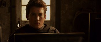 Movie still from “Fantastic Four” (2015), directed by Josh Trank – A young man is sitting in front of a computer; Close Up shot, Over the shoulder angle
