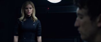 Movie still from “Fantastic Four” (2015), directed by Josh Trank – A woman standing in a dark room with a light on; Close Up shot, Low angle