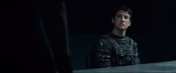 Movie still from “Fantastic Four” (2015), directed by Josh Trank – A man sitting at a table in front of a mirror; Medium shot, Over the shoulder angle