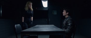 Movie still from “Fantastic Four” (2015), directed by Josh Trank – A woman and a man sitting at a table in a room; Medium shot, Over the shoulder angle